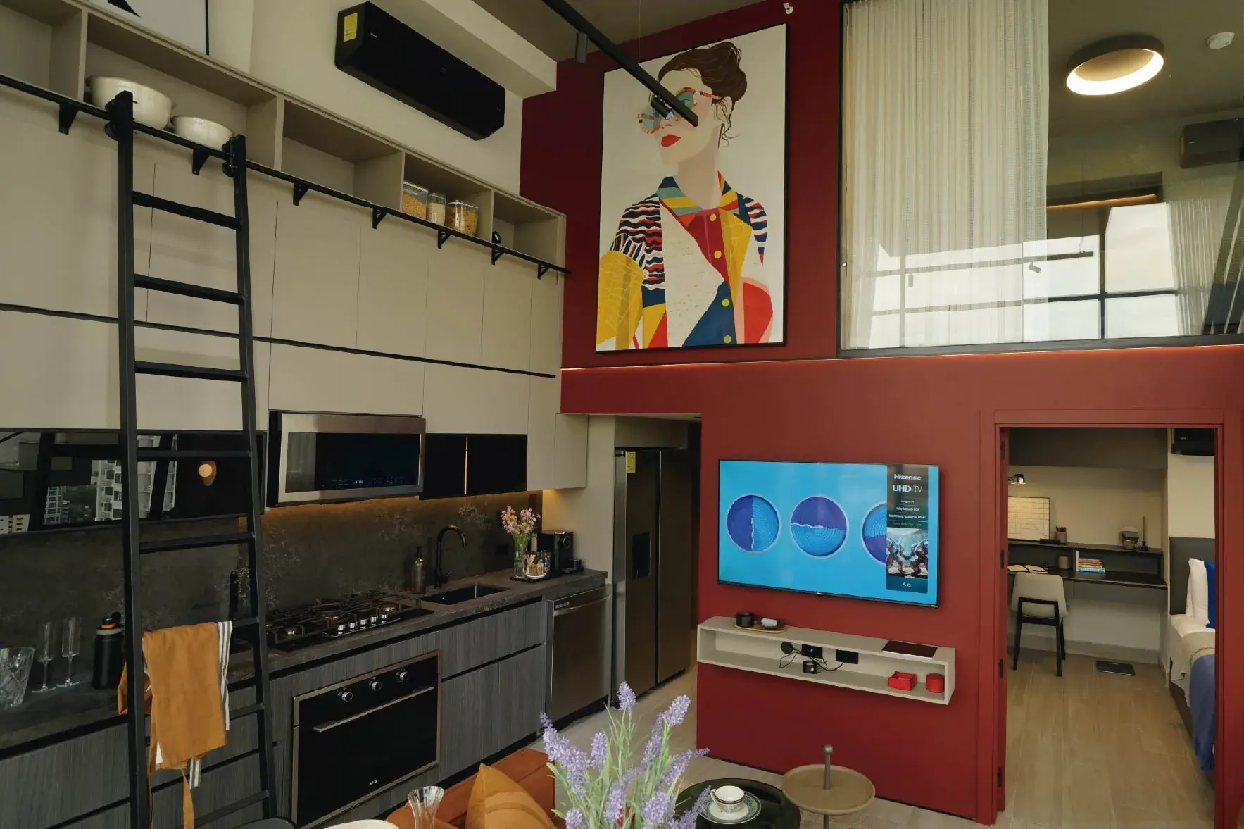 Loft kitchen with a library ladder at Dovle Cincuentenario.